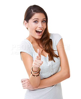 Buy stock photo A young woman pointing at the camera while looking surprised