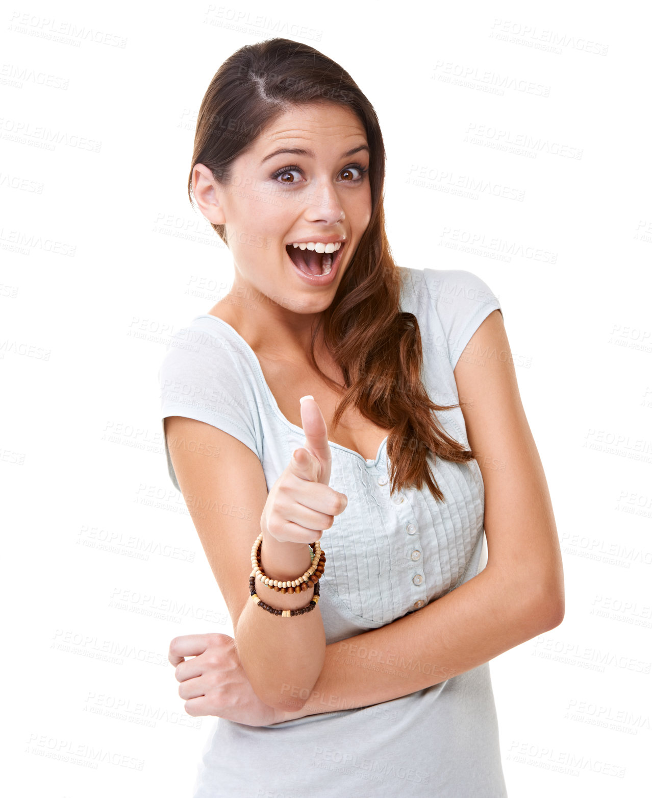 Buy stock photo A young woman pointing at the camera while looking surprised