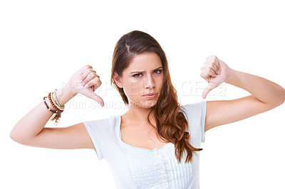 Buy stock photo Woman, angry face and thumbs down portrait in studio for sad news, mental health depression and vote no. Model, upset or frustrated hands sign for anger, depressed headshot or negative body language