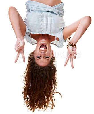 Buy stock photo Woman, peace hands and studio portrait while excited, upside down and hanging by white background. Gen z model, happy and isolated with peace sign, smile and laughing with beauty, fashion and edgy