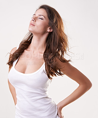 Buy stock photo Eyes closed, fashion and woman with confidence in studio for trendy clothes, casual outfit and style. Wind in hair, model and isolated person with pride, confident and beauty on white background