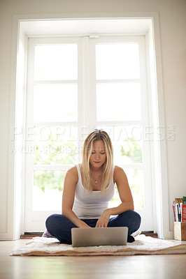 Buy stock photo Woman, remote work and laptop on floor in home, apartment or online education with internet course. Person, reading and typing on computer for university, elearning and project for college in house