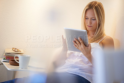 Buy stock photo Woman, tablet and relax on chair for research, online connection or social media in living room at home. Female person sitting and browsing technology for search, communication or networking on couch