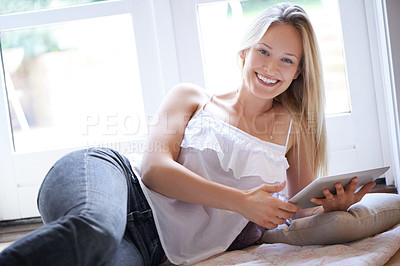 Buy stock photo Portrait, home and happy with woman, tablet and typing with connection, internet and website information. Person, apartment and girl with social media, smile and cheerful with network, tech or relax