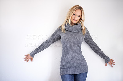 Buy stock photo Woman, portrait and smile in studio with fashion, winter outfit or casual style with hands or wall. Person, face and happy on mock up space with confidence, pride and joyful on white background