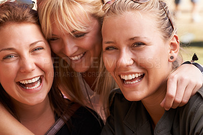 Buy stock photo Portrait of three smiling best friends embracing
