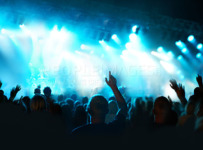 Buy stock photo Shot of a fans watching a live concert