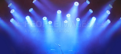 Buy stock photo A stage at a music festival with lights streaming down from above