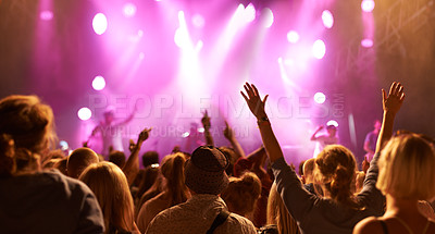 Buy stock photo Concert crowd, back and music festival band audience listen to rock, metal or hip hop artist, rap star or live stage performance. Night show freedom, community and fun fans cheers for musician singer