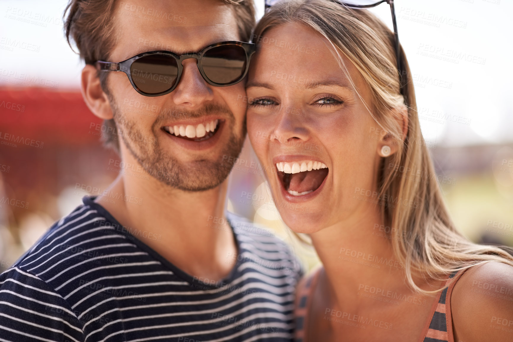 Buy stock photo Portrait of an attractive couple standing together and smiling