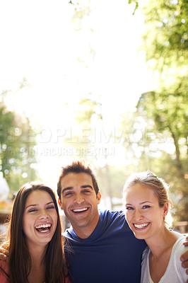 Buy stock photo A group of friends having fun together outdoors - with copy space