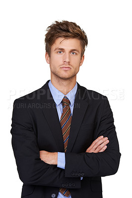 Buy stock photo Portrait of a handsome young businessman standing with his arms folded