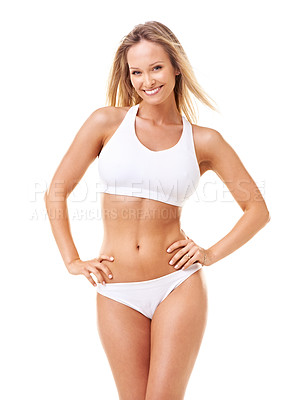 Buy stock photo A gorgeous young woman in sporty lingerie posing with hands on her hips against a white background