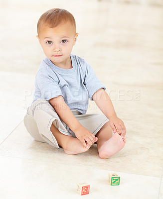 Buy stock photo Cute, building blocks and portrait of infant at his home playing for child development and growth. Sweet, youth and boy newborn, baby or kid having fun and standing with toys in a modern house. 