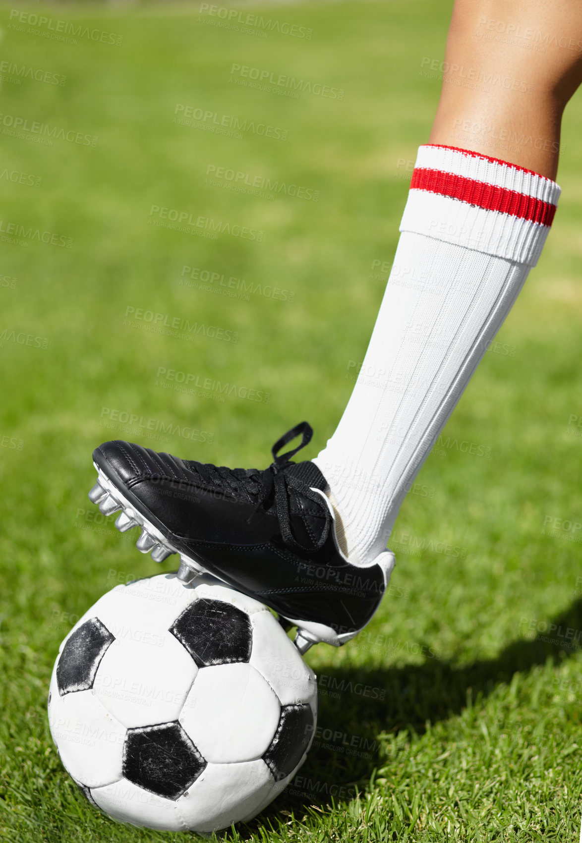 Buy stock photo Soccer, shoes and ball on field, sport and outdoor for competition, training and cleats in closeup. Football, person and steps with legs, foot and socks for exercise, grass and pitch for contest