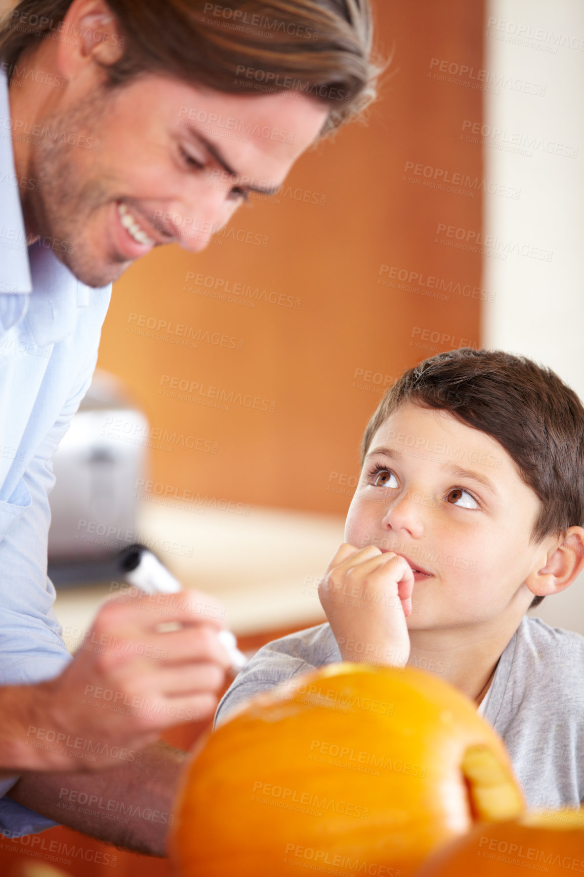 Buy stock photo Halloween, pumpkin and father with child in the kitchen for holiday celebration at home. Creative, smile and happy dad with boy kid bonding and carving vegetable for decoration or tradition at house.