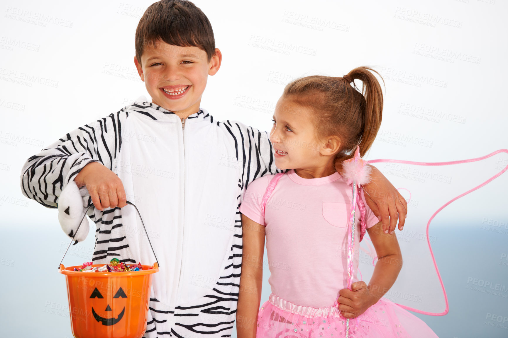 Buy stock photo Family, children and siblings with halloween, costume or hug outdoor with love, care or fun together. Happy, smile and kids in character for festival, holiday or fantasy, playing or bond with freedom