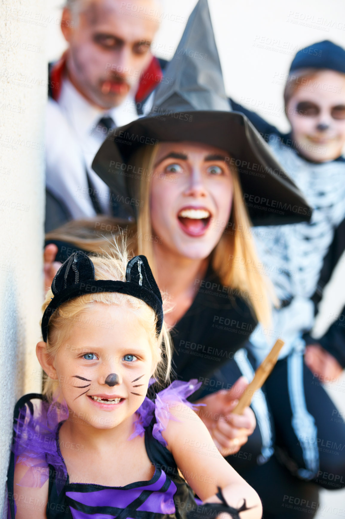 Buy stock photo Portrait, halloween and a family in costume for fantasy tradition or holiday celebration. Mother, father and children at a door in trick or treat clothes for dress up on allhallows eve together