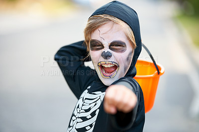 Buy stock photo Little boy dressed up as a skeleton fro Hallowe'en trying to scare you