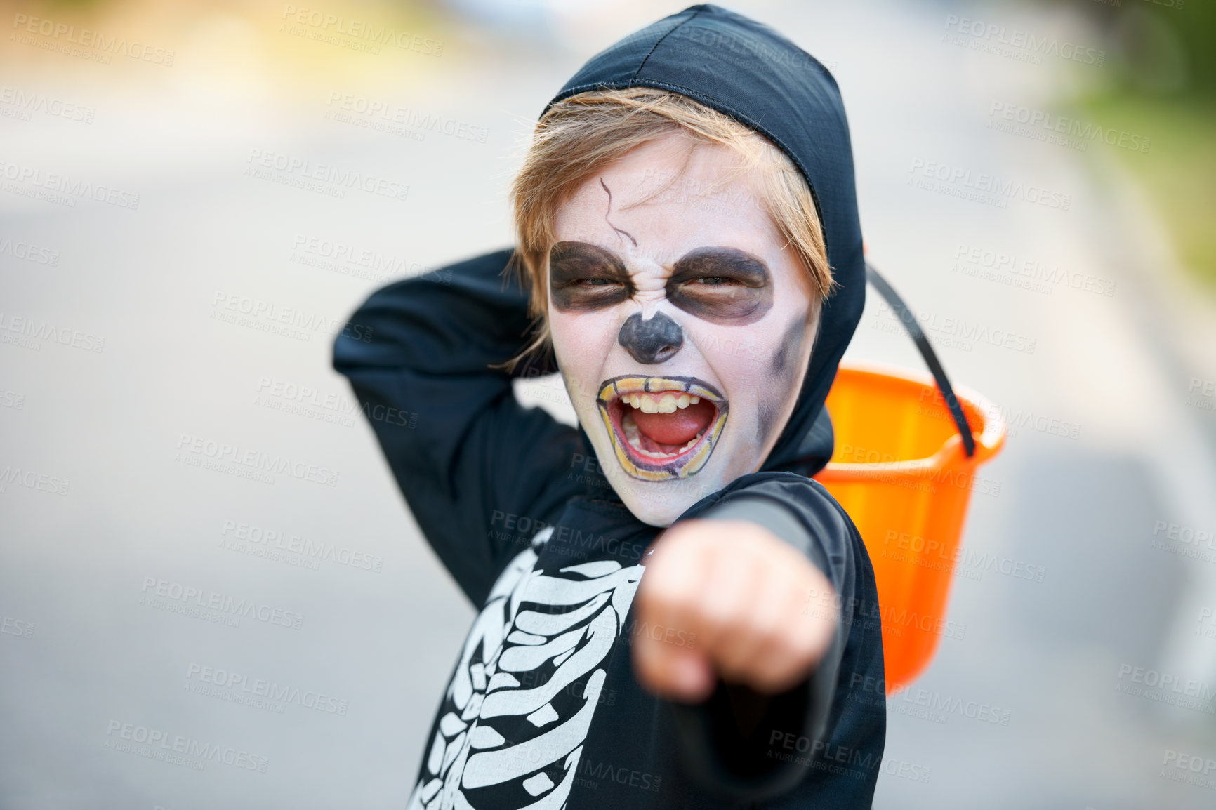 Buy stock photo Little boy dressed up as a skeleton fro Hallowe'en trying to scare you