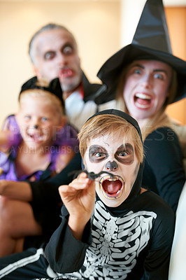 Buy stock photo A cute family dressed up for Hallowe&#039;en screaming at the camera