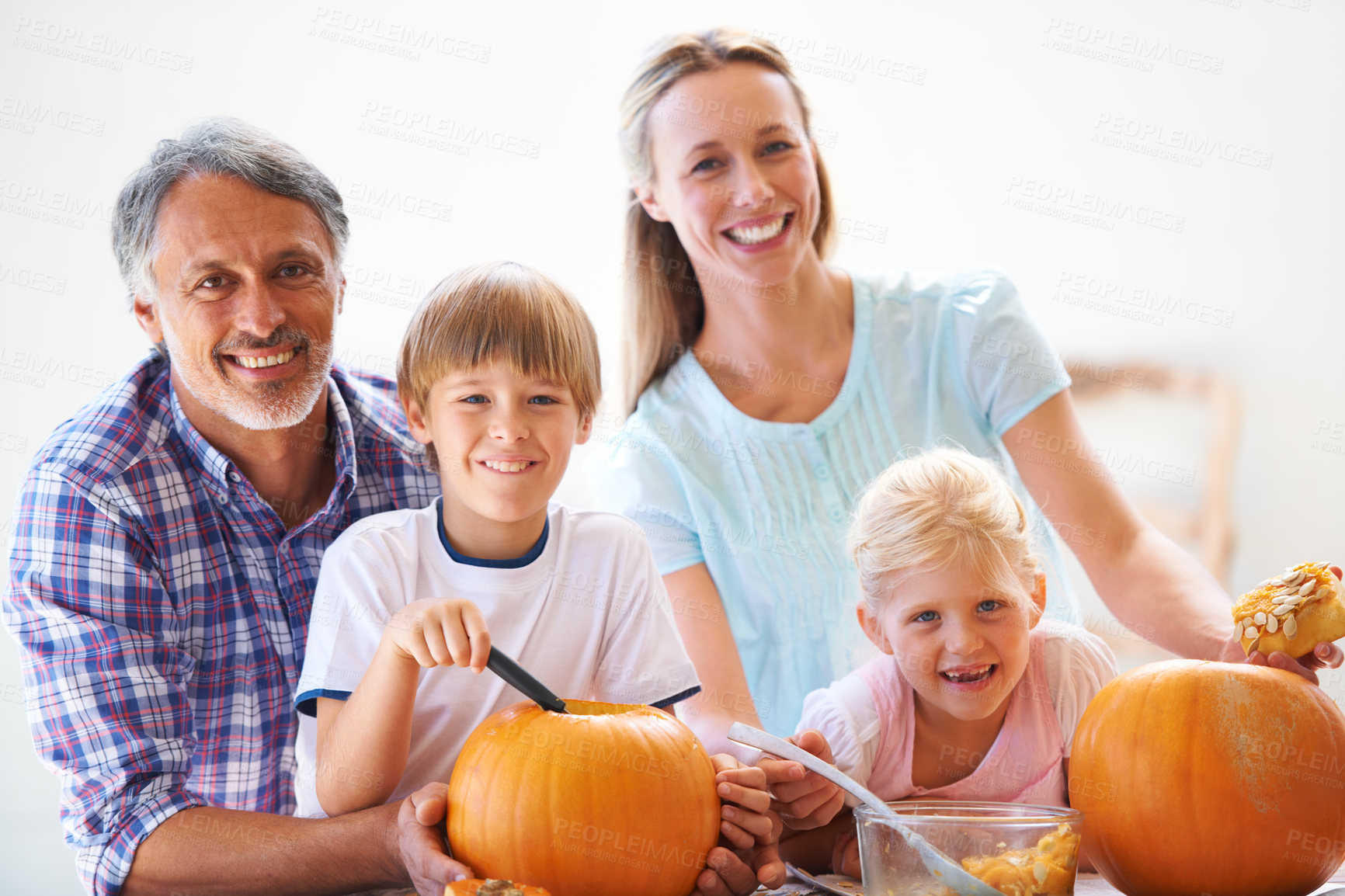 Buy stock photo Happy family, portrait and carving halloween pumpkins for holiday decoration, childhood memories and joyful. Parents, children and playful together with excitement, celebration and autumn tradition