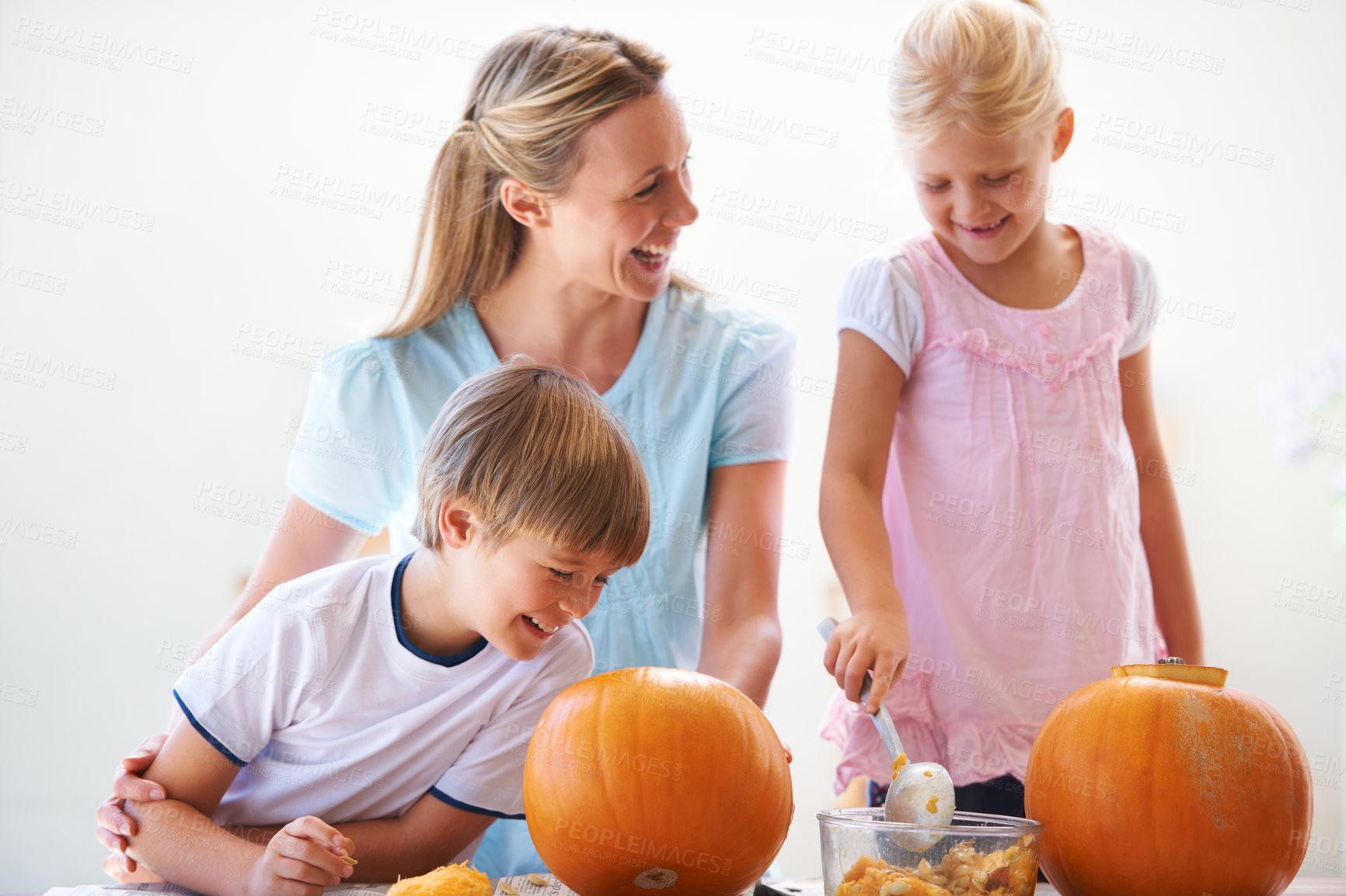 Buy stock photo Mother, children and carving halloween pumpkins in home, funny laugh and family bonding together. Mom, kids and vegetable for creative holiday decorations, party preparation and celebration lantern