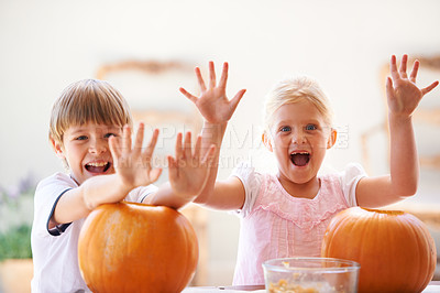 Buy stock photo Halloween, hands and carving a pumpkin with children at a home table for fun and bonding. Boy and girl or young kids as siblings together for creativity, holiday lantern and portrait or play in house