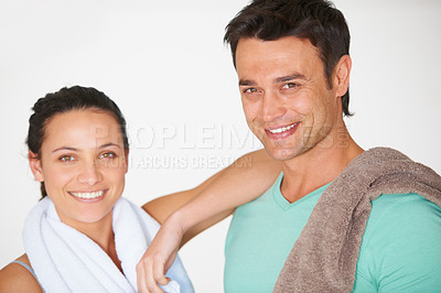 Buy stock photo Happy couple, portrait and towel in fitness, exercise or gym training together against a studio background. Man and woman smile in break, rest or relax after workout, health and wellness on mockup