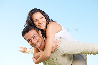 Buy stock photo Happy couple, portrait and piggyback with love, marriage and enjoying a break on holiday, smile and funny. Playful, vacation and honeymoon for having fun, carefree and romantic relationship
