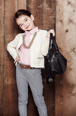 Buy stock photo Portrait of an adorable little girl dressed fashionably with a handbag