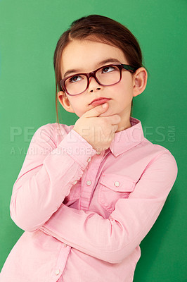 Buy stock photo Thinking, ideas and girl with focus, green screen and thoughts against a studio background. Kid, female child and young person with wonder, opportunity and ponder with facial expression and future