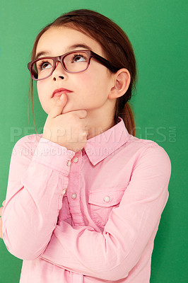 Buy stock photo Green screen, ideas and girl with focus, future and decision against a studio background. Female child, geek and nerd with glasses, thoughts and thinking with young person, choice and opportunity