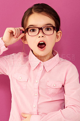Buy stock photo Portrait, surprise and girl child with glasses in studio isolated on a pink background. Kid, nerd and shocked person, wow or omg emoji, gossip and reaction to unexpected news, announcement or secret.
