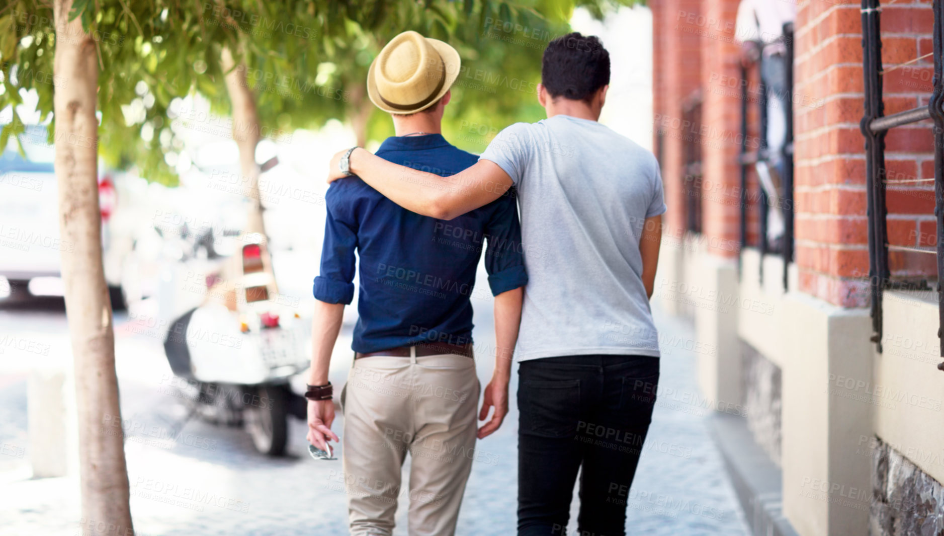 Buy stock photo Travel, city and back of men walking in the road together while embracing on a tourism weekend trip. Affection, sightseeing and male friends in an urban street of a town on a holiday or vacation.