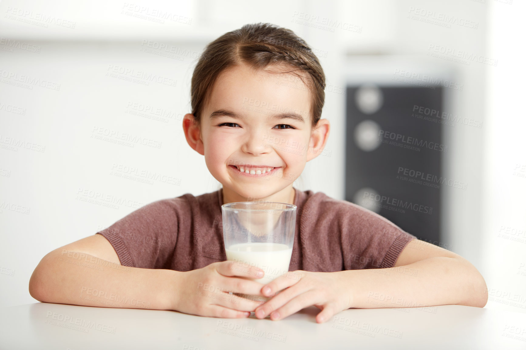 Buy stock photo Portrait of a cute little girl enjoying a glass of milk