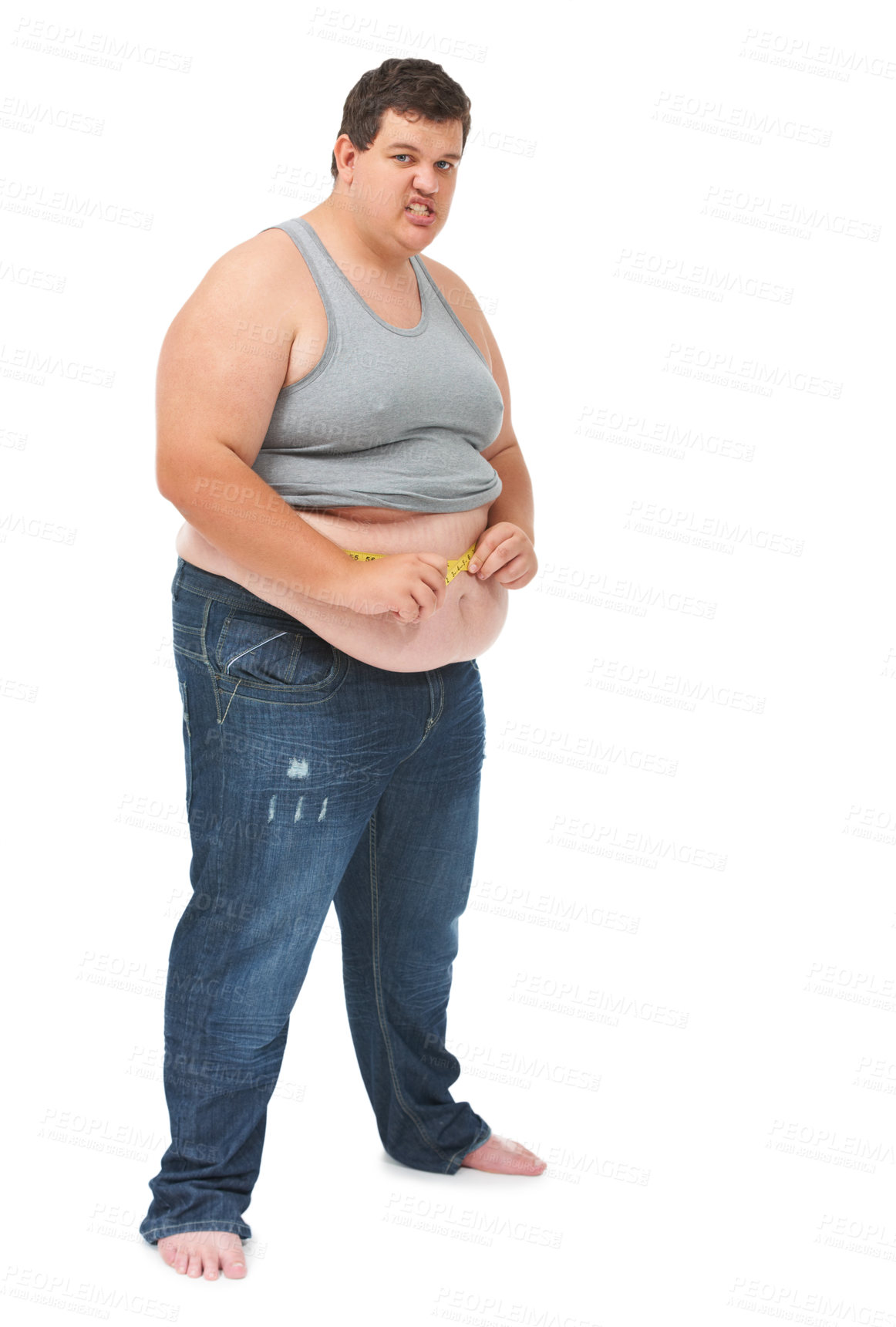Buy stock photo Obesity, tape measure on abdomen and portrait of angry man checking size, body health and isolated on white background. Frustrated male, measuring stomach and weight loss progress on studio backdrop.