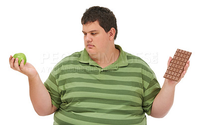 Buy stock photo Plus size, diet decision and man with a apple and candy choice thinking about balance. Male model, studio and white background with healthy and chocolate with weight loss and nutrition problem