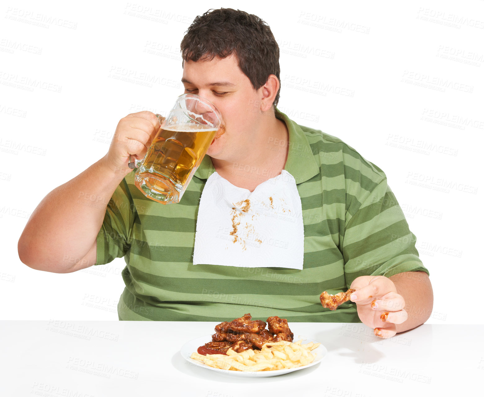 Buy stock photo Obesity, man and fast food with alcohol, unhealthy and guy isolated against a white studio background. Obese, male person and model with beer, chicken wings and eating with a bib, fries and hungry