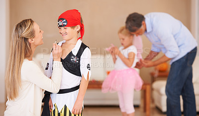 Buy stock photo Boy, pirate costume and halloween with mother in home, face paint and happiness in childhood. Son, smile and house birthday with party clothes by woman, love family and celebration together with care