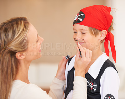 Buy stock photo Boy, pirate costume and halloween in home, woman and face paint for happiness in childhood. Son, smile and mother with party make up, love family and bonding together with care celebration in house