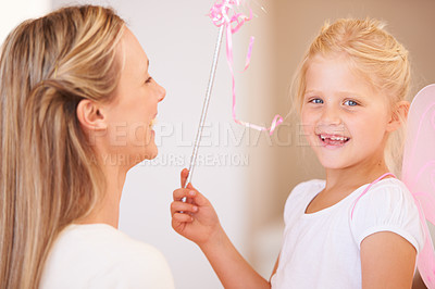 Buy stock photo Daughter, fairy costume and portrait with mother in home, halloween party and happiness in childhood. Girl, smile face and fashion for event with mom, love family and celebration with care in house