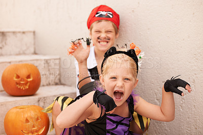 Buy stock photo Siblings, portrait and halloween costume by outdoor, theme paint and happiness in childhood. Boy, girl or scary face for holiday party event with pumpkin, excited fairy or pirate by backyard stairs