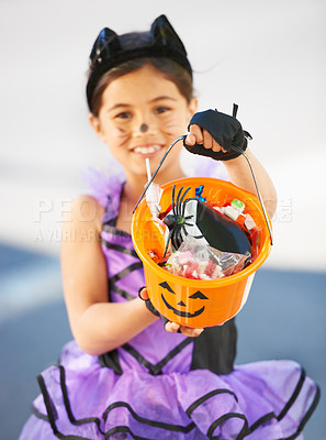 Buy stock photo Halloween, child or trick and treat bucket portrait outdoor in neighborhood for fun and dress up. A young girl kid excited with happiness, celebrate holiday and candy or sweets for snack in road