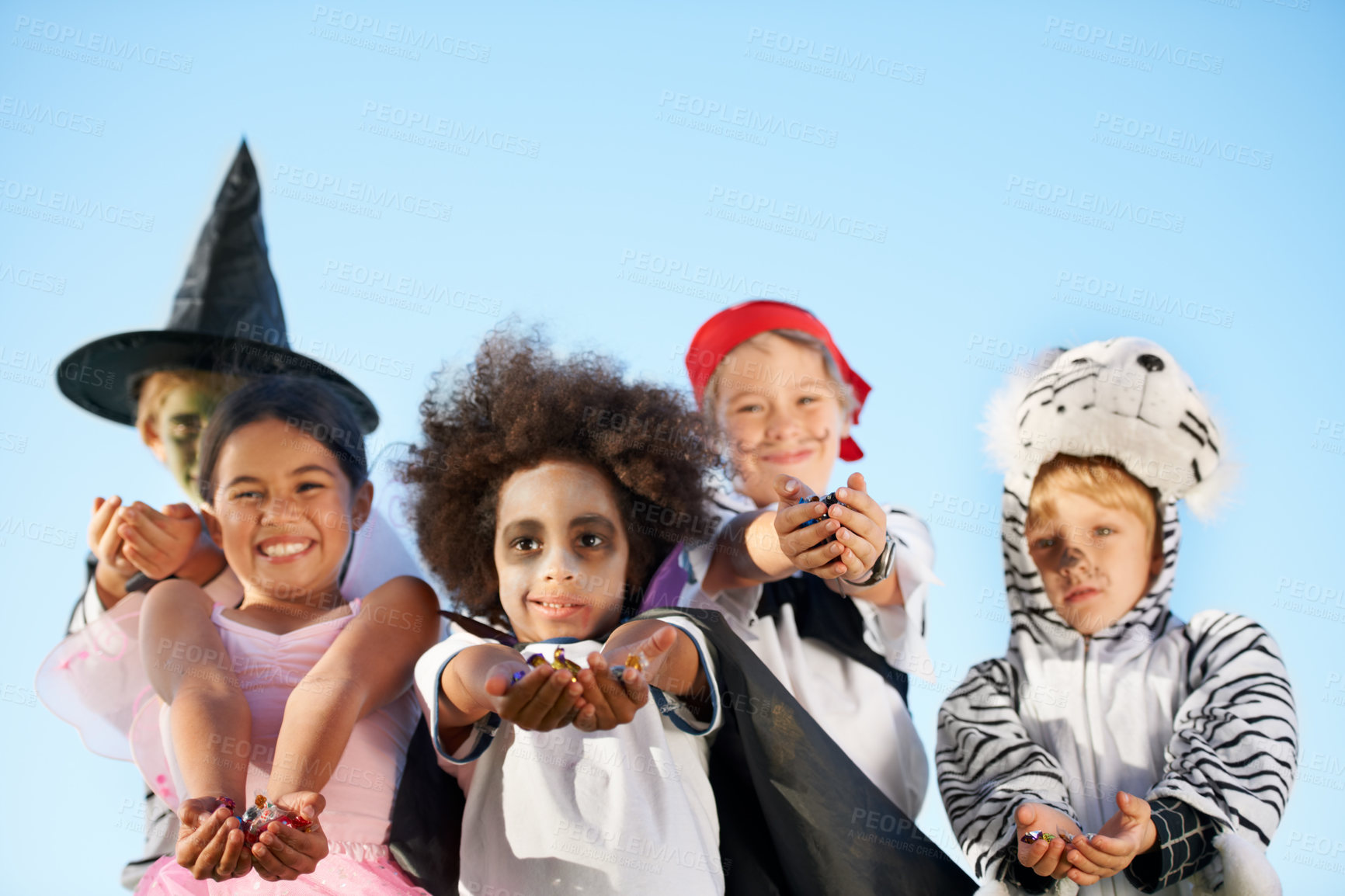 Buy stock photo Children, hands and portrait for halloween costume for sweet candy asking, trick or treat for fantasy. Friends, group and dress up as witch or pirate for holiday, kid development on sky background