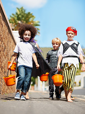 Buy stock photo Halloween, children or trick and treat portrait outdoor in neighborhood for fun and dress up. A group of young kids together for happiness, celebrate holiday and diversity with candy or sweets