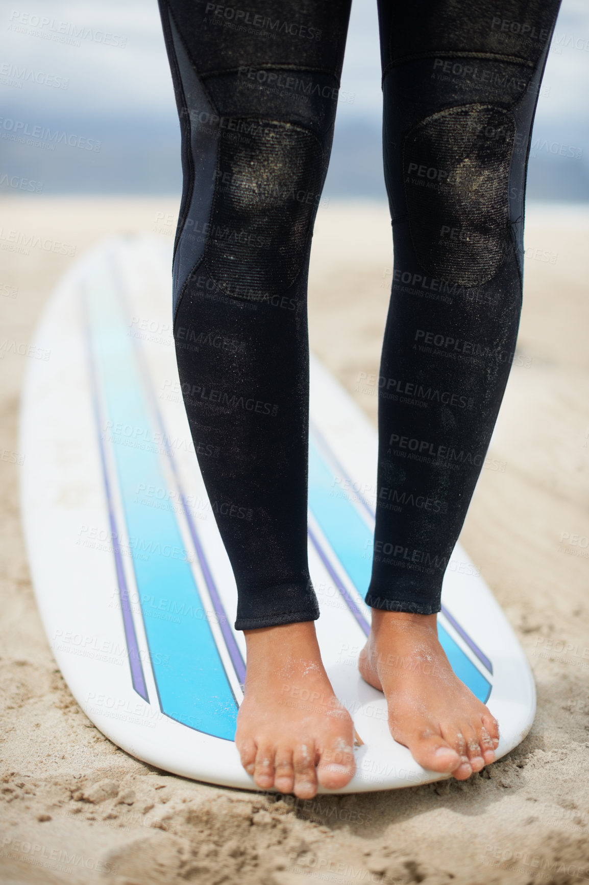 Buy stock photo Feet, balance and surfboard with a person on the beach for fitness, recreation or sports training closeup. Legs, sand and nature with an athlete surfing outdoor on the coast for exercise or health