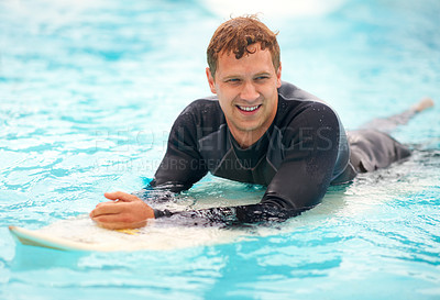 Buy stock photo Young, man and surfer in ocean with board, health fitness and happy in summer with water sports. Person, smile and relax wellness in caribbean beach with vacation, adventure and wetsuit for workout