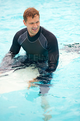 Buy stock photo Confident, man or surfer in ocean with board, health fitness or happy in summer with water sports. Person, smile and relax wellness in caribbean beach with vacation, adventure and wetsuit for workout