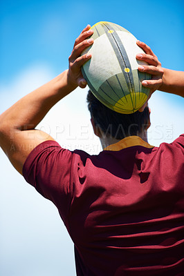 Buy stock photo Back, rugby and man with a ball, game and fitness with exercise, playing and workout. Professional player, guy and athlete with training, practice for a match and sports with confidence and wellness